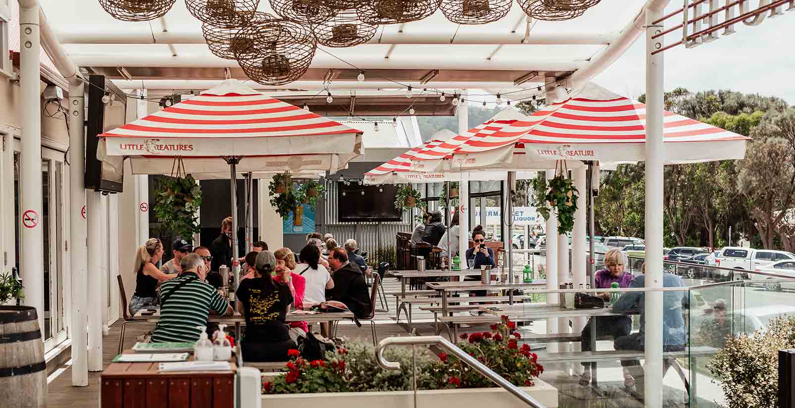 People eat at cafes on the main street of Apollo Bay